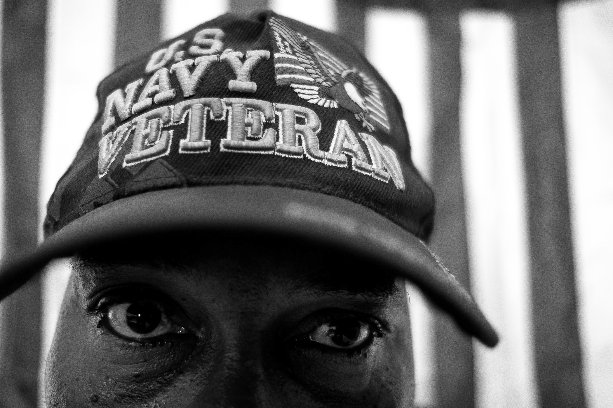 Deported U.S. Navy veteran Steven B. Pierre, 51, poses for a portrait in a hotel room in Port-au-Prince, Haiti, Friday, June 29, 2018.   Pierre served in the U.S. Navy from 1990 to 1991 and received a medical discharge after falling down a submarine ladder stationed at a Naval dry dock in Connecticut. He tore up ligaments and tendons on his left knee and is currently service connected. He receives pain killers for his knee injury, and because of it, he also suffers from secondary injuries to his right knee and lower back.   "I never thought that I was an immigrant," said Pierre. "I always thought that I was an American because I was raised the American way."   He has four children in the United States that grew up without him physically there for the majority of their lives. (Photo by Joel Angel Juárez/GroundTruth) 