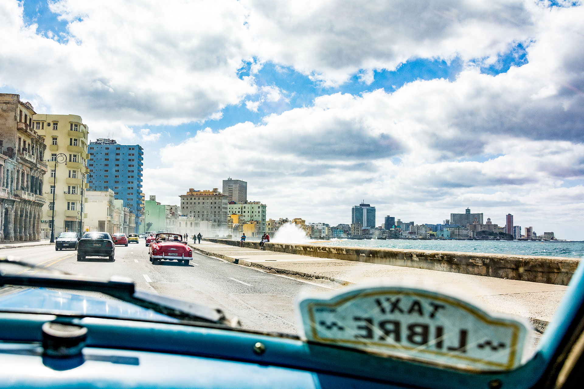 Waves crash over the Malecón, the major seaside roadway in Havana, Cuba, on March 6, 2019. (Photo by Story Hinckley/GroundTruth)